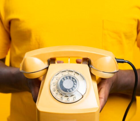 close-up-man-holding-old-phone